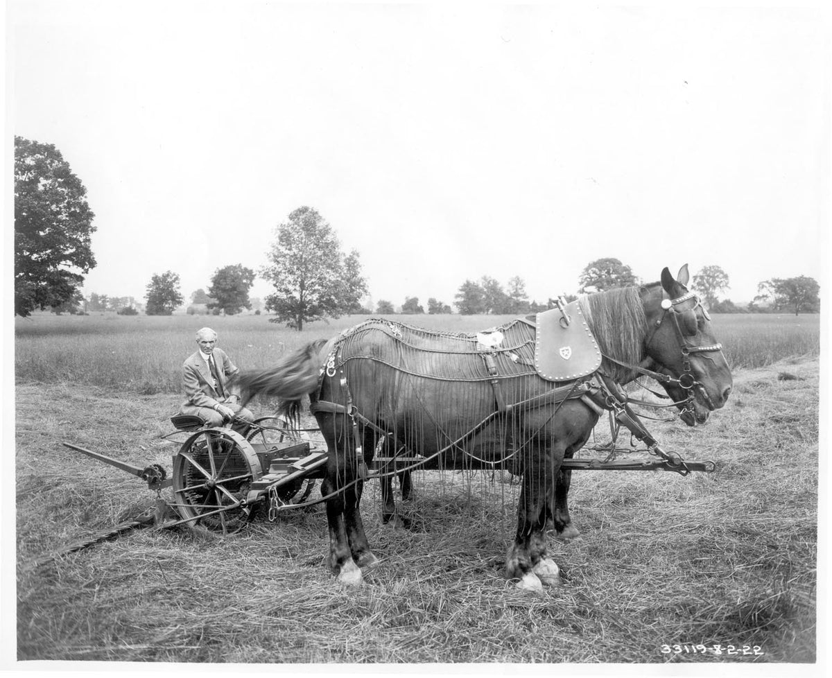 Ford Motor Company archival image documenting Henry Ford Mowing Machin 1922.