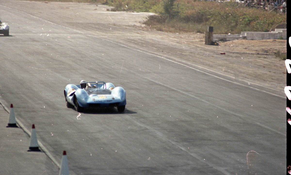 1965 Open-cockpit race car on circuit — Nassau — 0065-0010