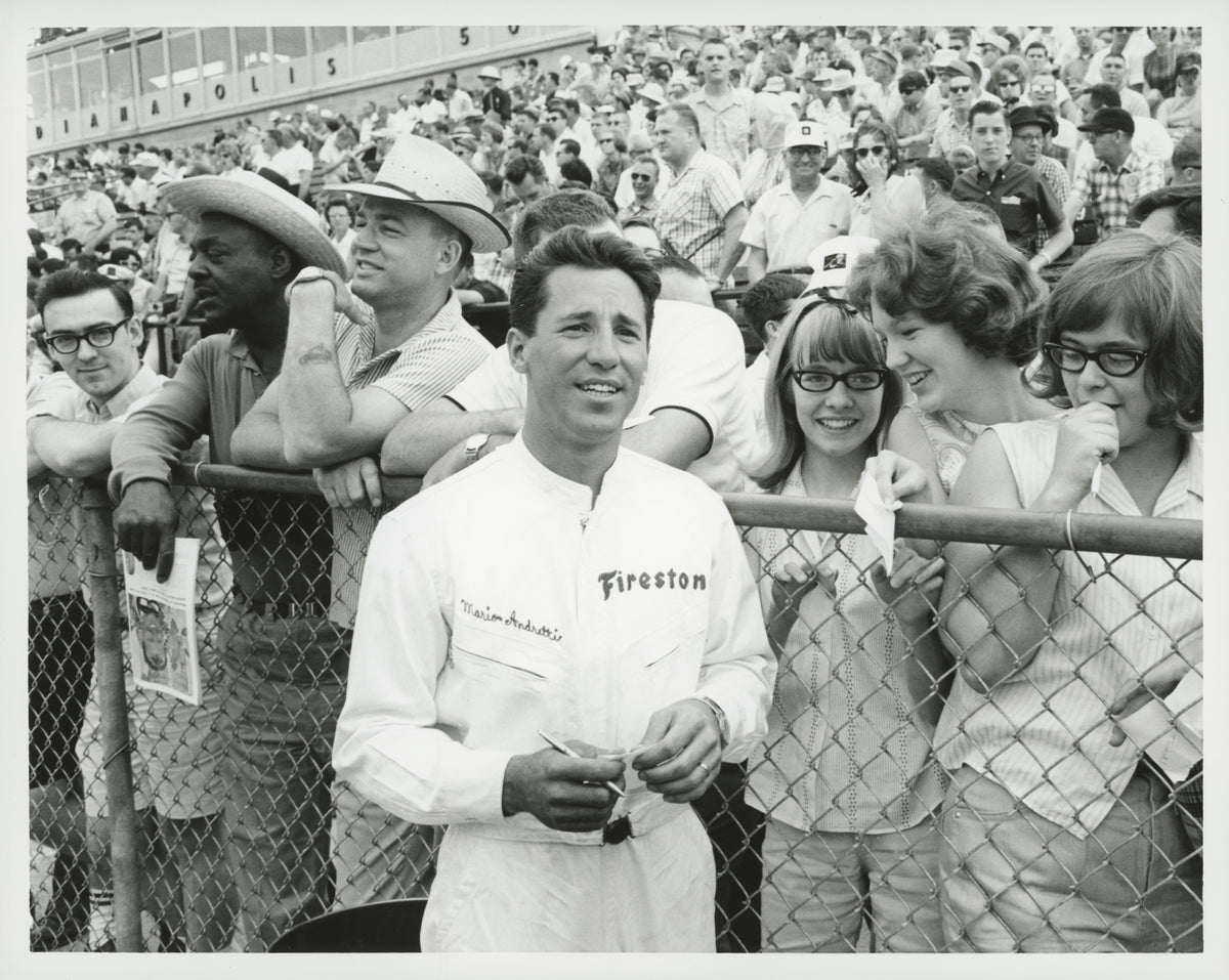 1965 — Mario Andretti with Fans at the 49th Indianapolis 500, May 1965 — Fordimages 0065-0066; source THF141331