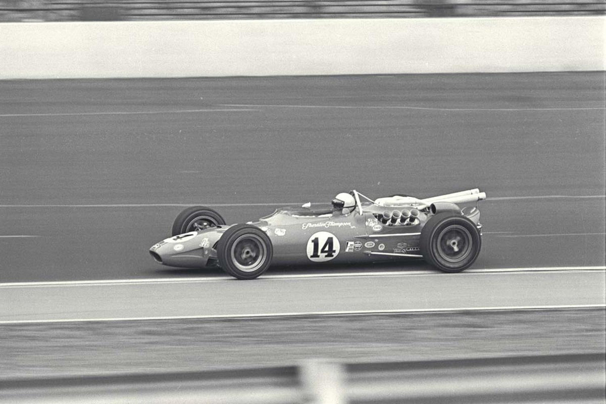 Original archival image documenting 1967 Indianapolis 500 Indiana AJ Foyt inside Turn 1.