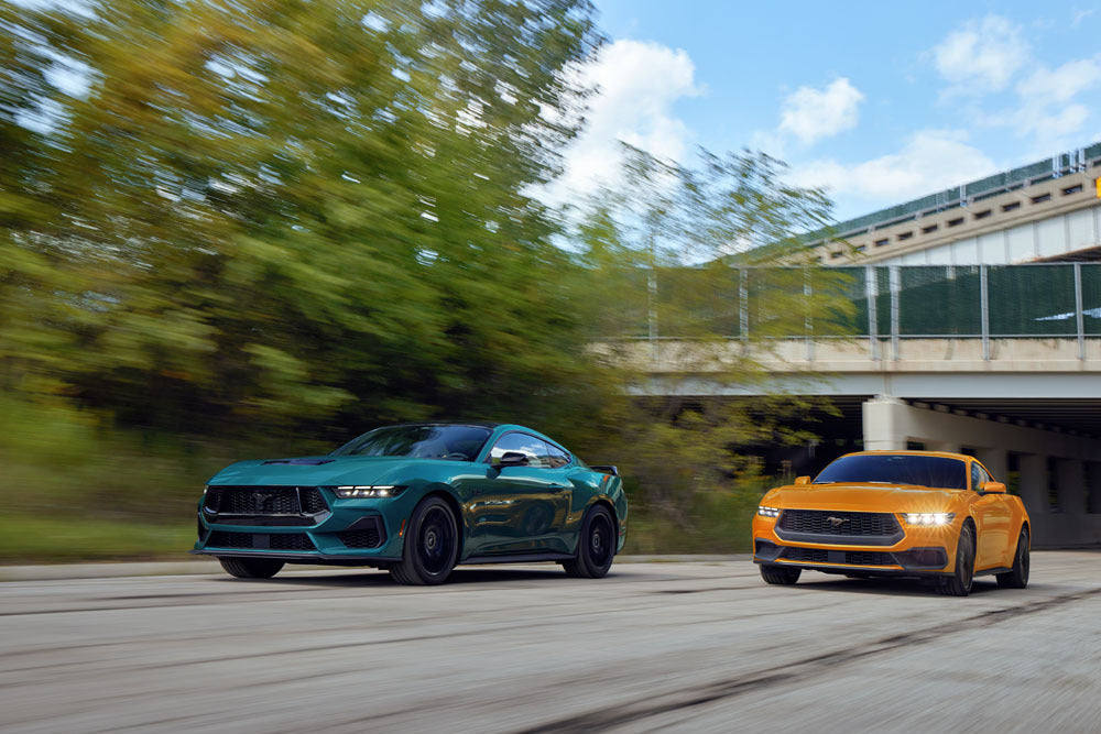 Official Ford Motor Company image of 2026 Mustang GT and Mustang EcoBoost fastbacks.
