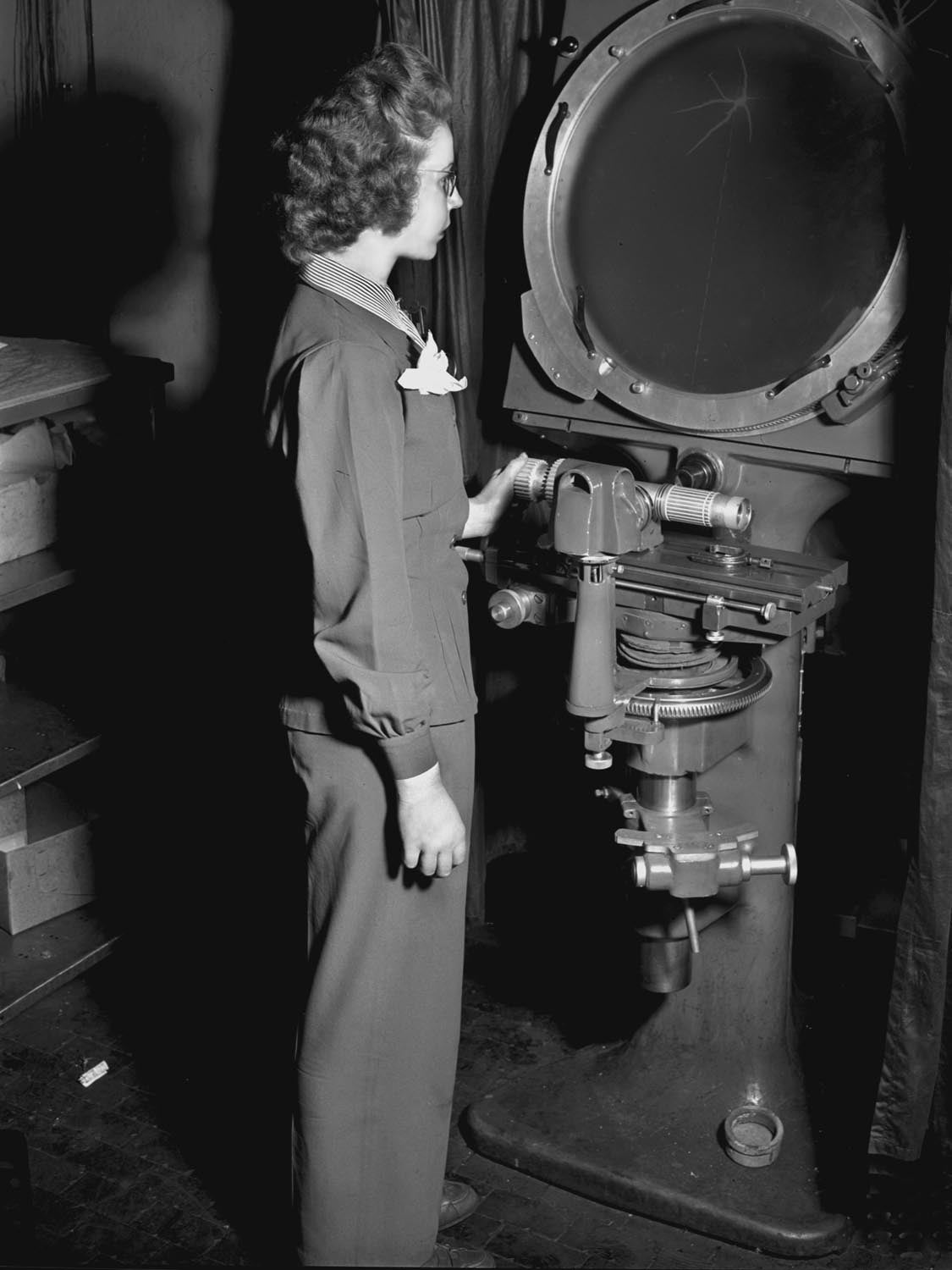 1943 Aircraft Building woman inspecting component 0400-8967