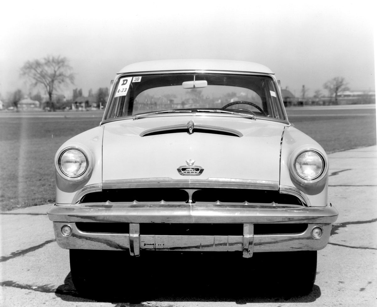 This archival image documents the 1952 Monarch Coupe front view on road AR-2007-5 and is preserved in the Ford Heritage Vault as part of Ford Motor Company's historic photographic archive. Free for personal, non-commercial use. Ford Heritage Vault...