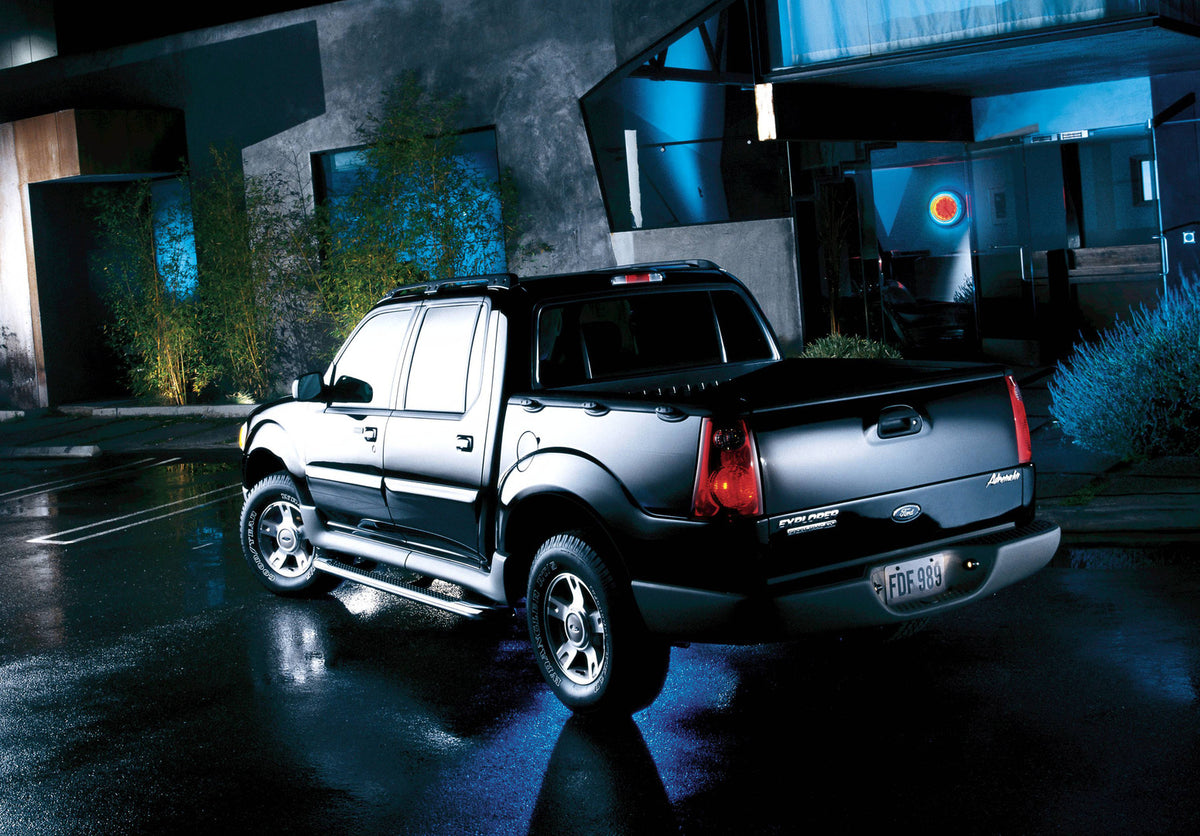 This archival image documents the 2004 Ford Explorer Sport Trac Adrenaline and is preserved in the Ford Heritage Vault as part of Ford Motor Company's historic photographic archive. Free for personal, non-commercial use. Ford Heritage Vault refere...