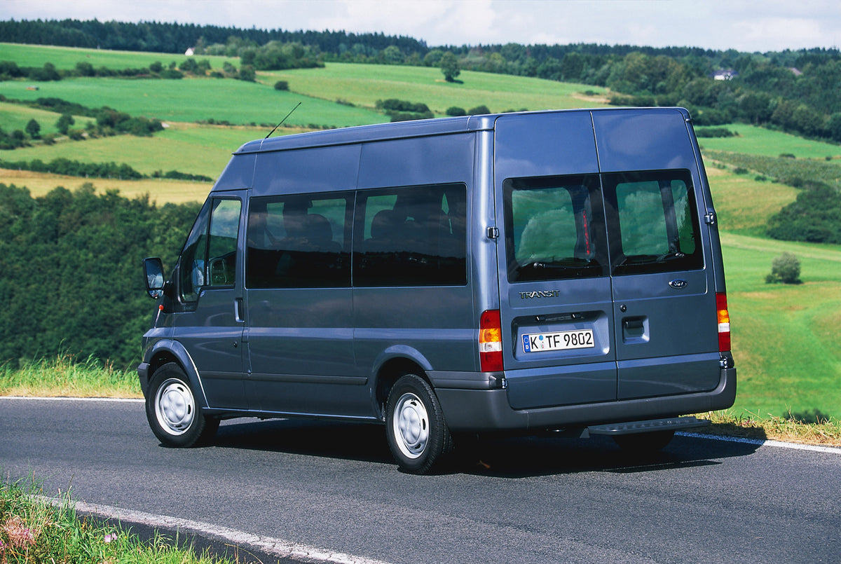 This archival image documents the 2000 Ford Transit Mark VI FWD rear view on scenic road and is preserved in the Ford Heritage Vault as part of Ford Motor Company's historic photographic archive. Free for personal, non-commercial use. Ford Heritag...