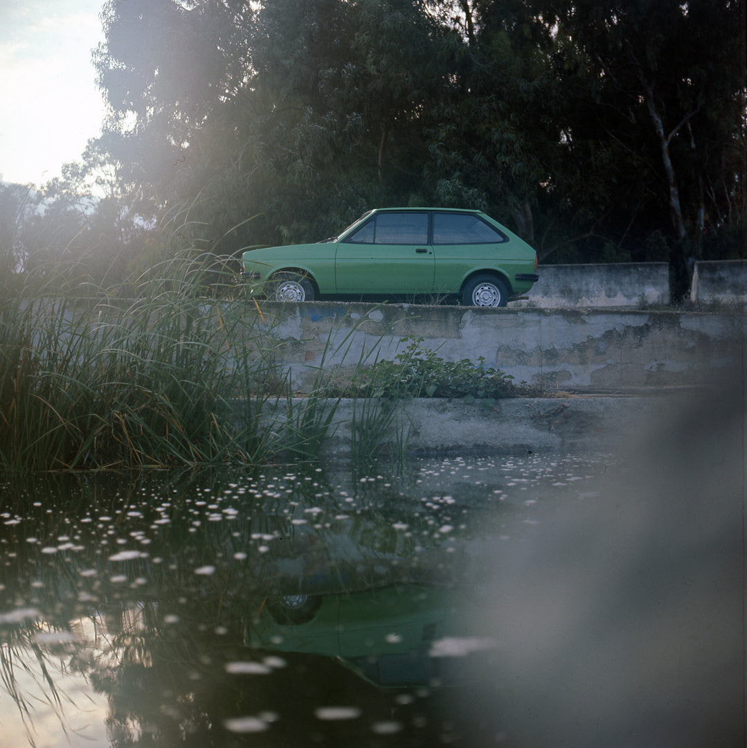 This archival image documents the 1976 Ford Fiesta Mark I 1.1 Ghia side view with scenic pond and trees and is preserved in the Ford Heritage Vault as part of Ford Motor Company's historic photographic archive. Free for personal, non-commercial us...