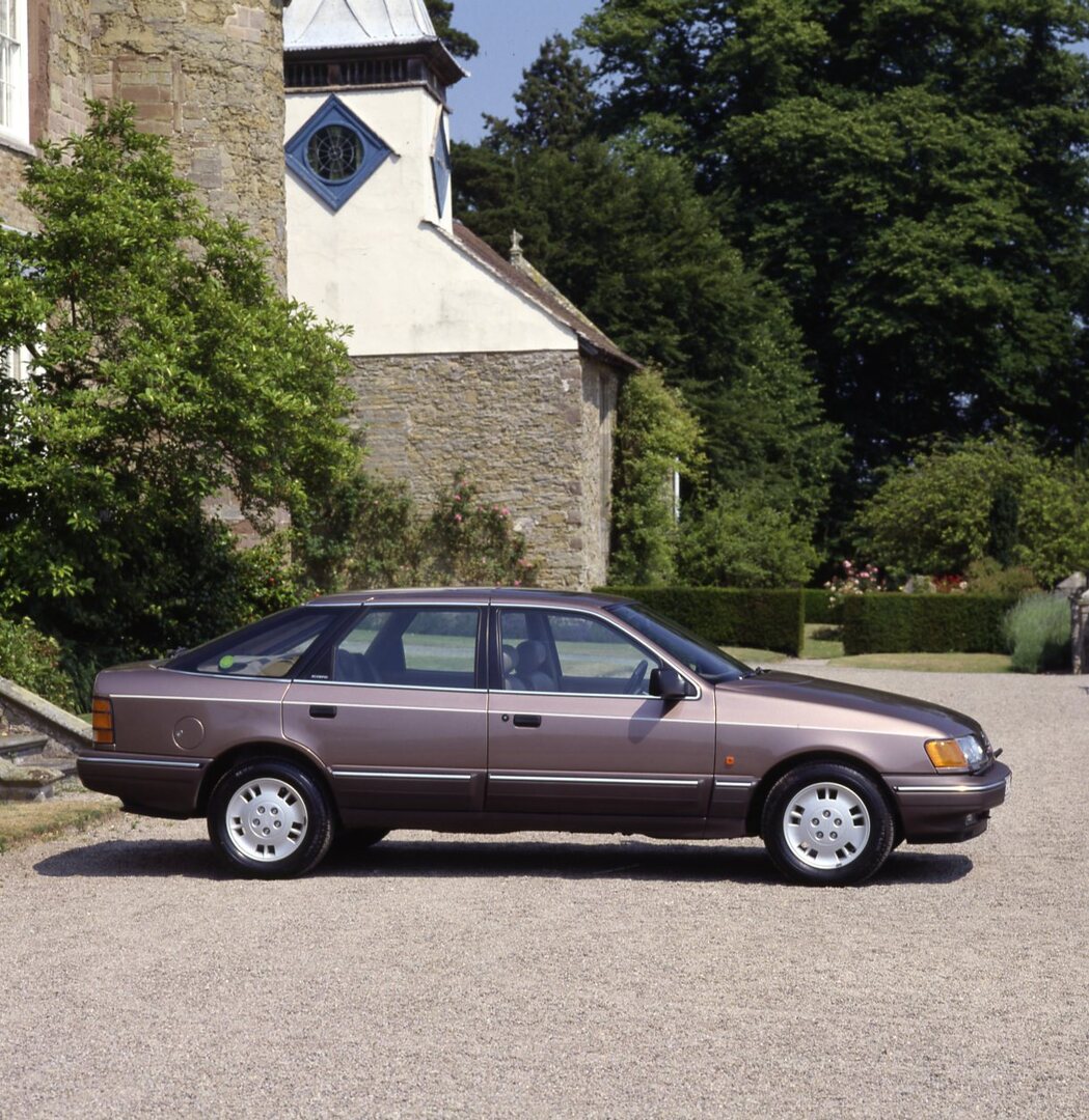 This archival image documents the 1989 Ford Granada Scorpio Mark III side view in front of scenic building and is preserved in the Ford Heritage Vault as part of Ford Motor Company's historic photographic archive. Free for personal, non-commercial...