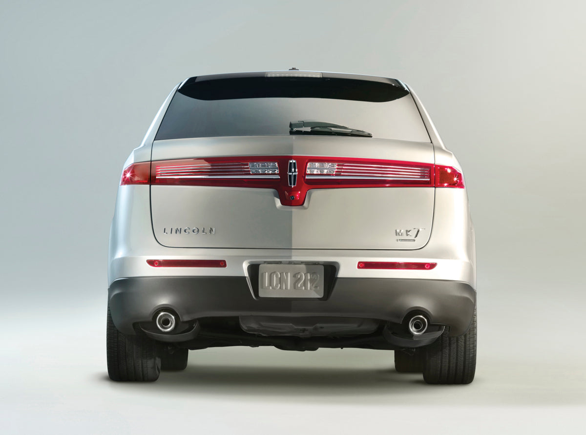 This archival image documents the 2013 Lincoln MKT rear view in studio MS4433 and is preserved in the Ford Heritage Vault as part of Ford Motor Company's historic photographic archive. Free for personal, non-commercial use. Ford Heritage Vault ref...