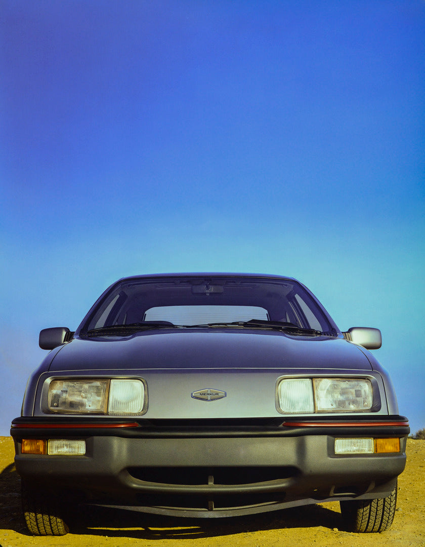 This archival image documents the 1986 Merkur XR4Ti front end headlights grille and is preserved in the Ford Heritage Vault as part of Ford Motor Company's historic photographic archive. Free for personal, non-commercial use. Ford Heritage Vault r...