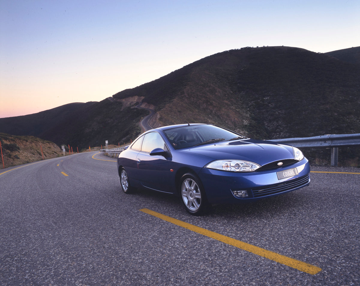This archival image documents the 2001 Ford SW Cougar Driver Side Front End View on Country Road FAP-2011-3 and is preserved in the Ford Heritage Vault as part of Ford Motor Company's historic photographic archive. Free for personal, non-commercia...