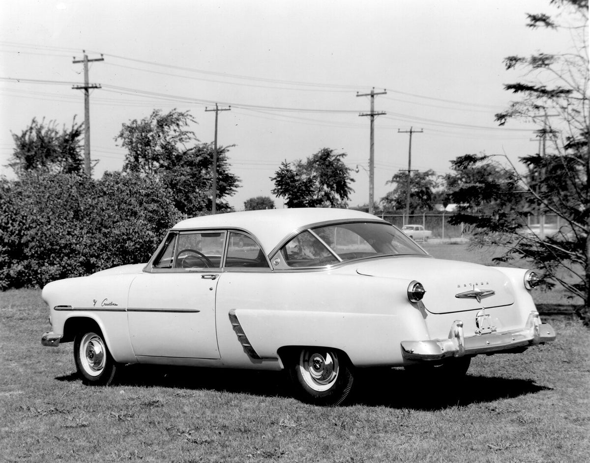 This archival image documents the 1952 Meteor Crestline Coupe rear view with scenic trees AR-2007-5 and is preserved in the Ford Heritage Vault as part of Ford Motor Company's historic photographic archive. Free for personal, non-commercial use. F...