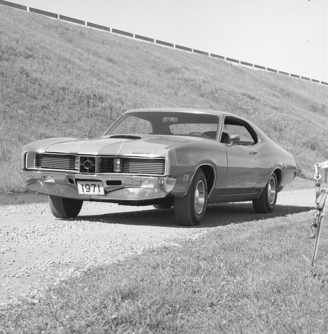 This archival image documents the 1971 Mercury Cyclone Spoiler two-door hardtop and is preserved in the Ford Heritage Vault as part of Ford Motor Company's historic photographic archive. Free for personal, non-commercial use. Ford Heritage Vault r...