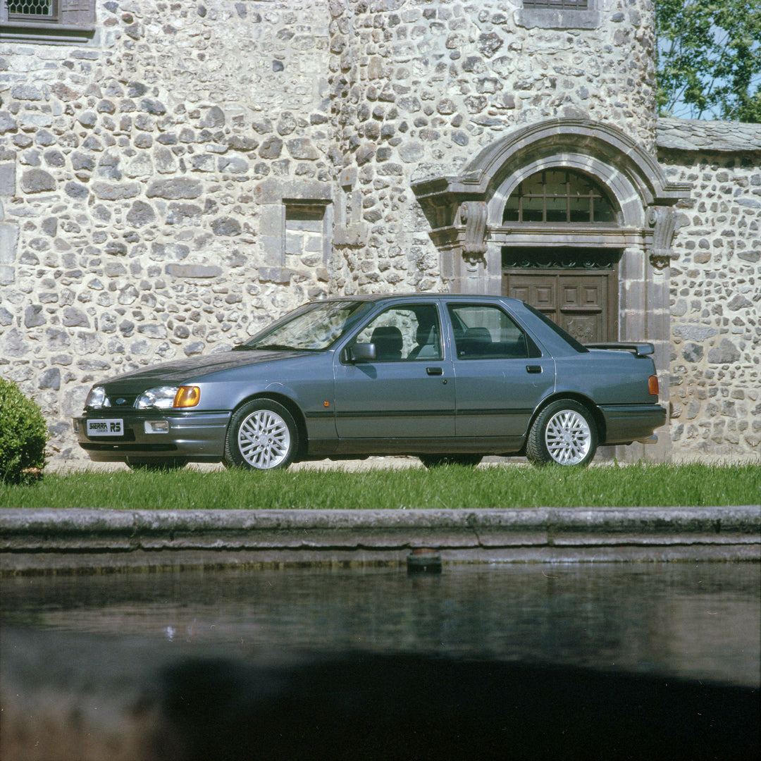 This archival image documents the 1987 Ford Sierra RS Cosworth low view in front of scenic castle in France and is preserved in the Ford Heritage Vault as part of Ford Motor Company's historic photographic archive. Free for personal, non-commercia...