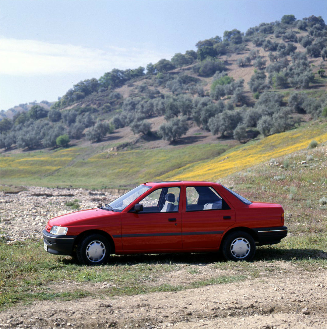 This archival image documents the 1990 Ford Orion Mark III side view in scenic valley and is preserved in the Ford Heritage Vault as part of Ford Motor Company's historic photographic archive. Free for personal, non-commercial use. Ford Heritage V...