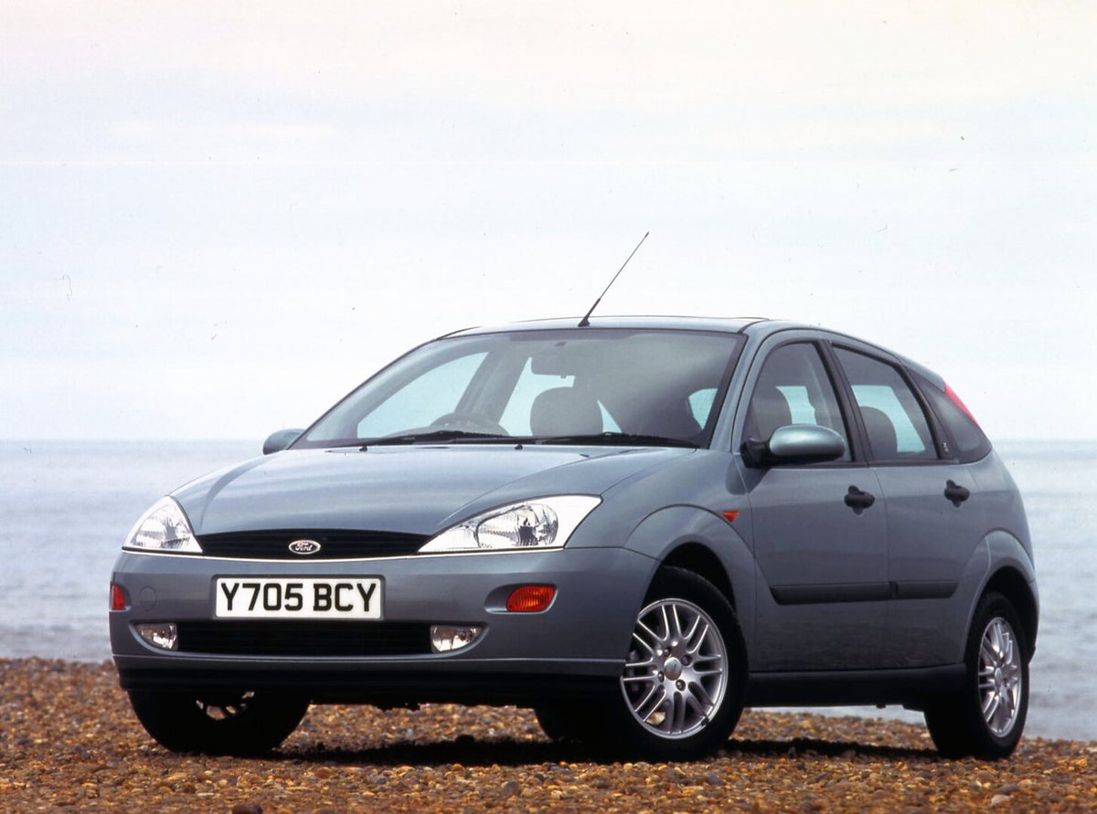 This archival image documents the 2001 Ford Focus Mark I Ghia closeup on scenic beach and is preserved in the Ford Heritage Vault as part of Ford Motor Company's historic photographic archive. Free for personal, non-commercial use. Ford Heritage V...