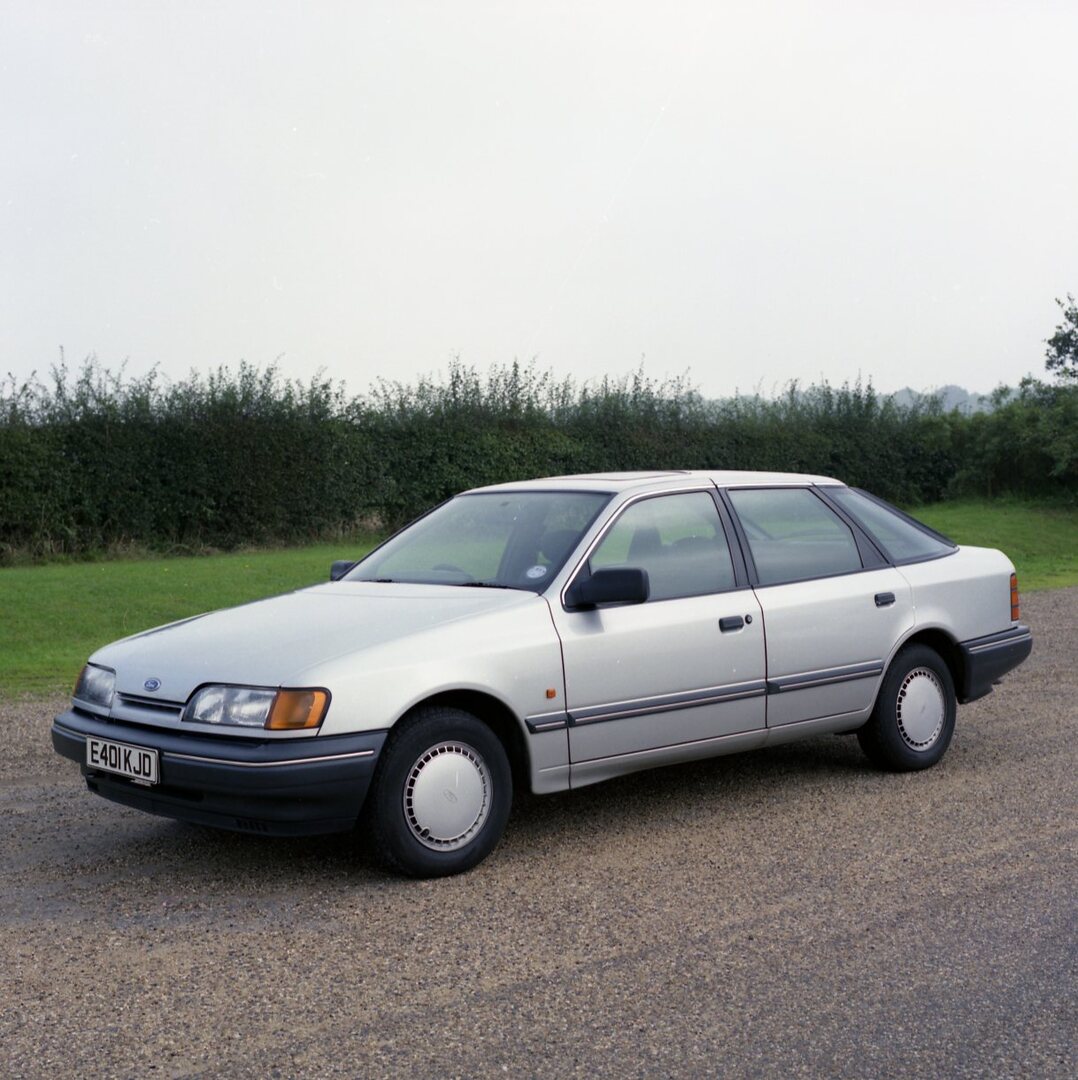 This archival image documents the 1987 Ford Granada Mark III GL on scenic road and is preserved in the Ford Heritage Vault as part of Ford Motor Company's historic photographic archive. Free for personal, non-commercial use. Ford Heritage Vault re...