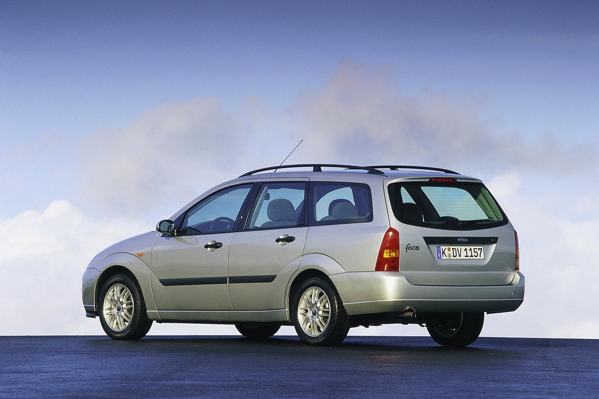 This archival image documents the 2001 Ford Focus rear view with scenic cloudy sky and is preserved in the Ford Heritage Vault as part of Ford Motor Company's historic photographic archive. Free for personal, non-commercial use. Ford Heritage Vaul...
