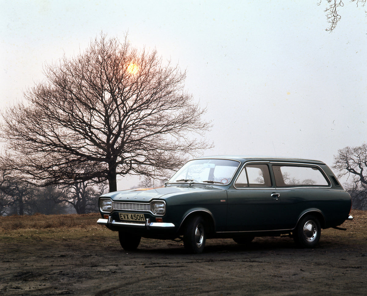 This archival image documents the 1970 Ford Escort Mark I Estate with scenic trees and is preserved in the Ford Heritage Vault as part of Ford Motor Company's historic photographic archive. Free for personal, non-commercial use. Ford Heritage Vaul...