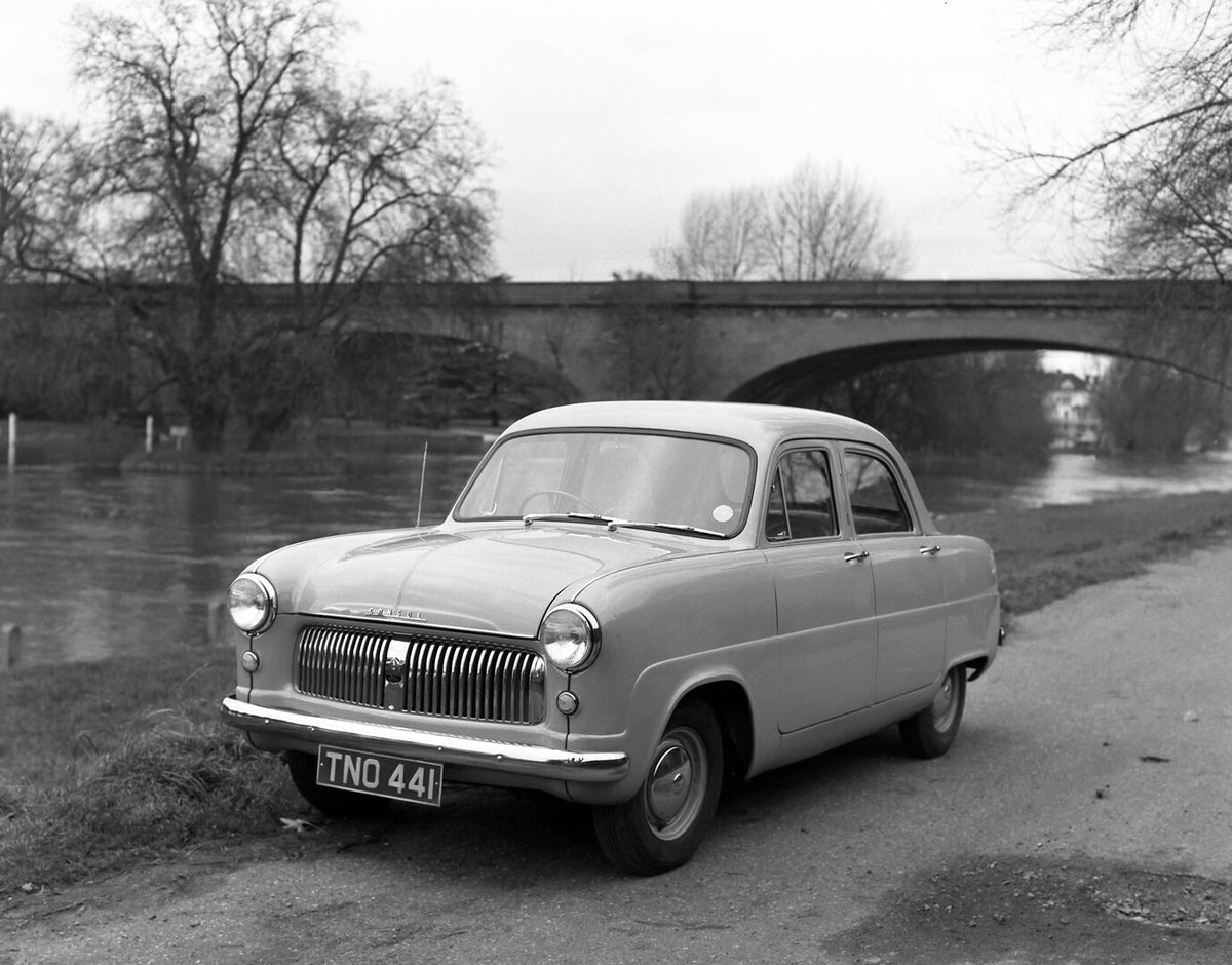 This archival image documents the 1951 Ford Consul on scenic road with bridge and is preserved in the Ford Heritage Vault as part of Ford Motor Company's historic photographic archive. Free for personal, non-commercial use. Ford Heritage Vault ref...