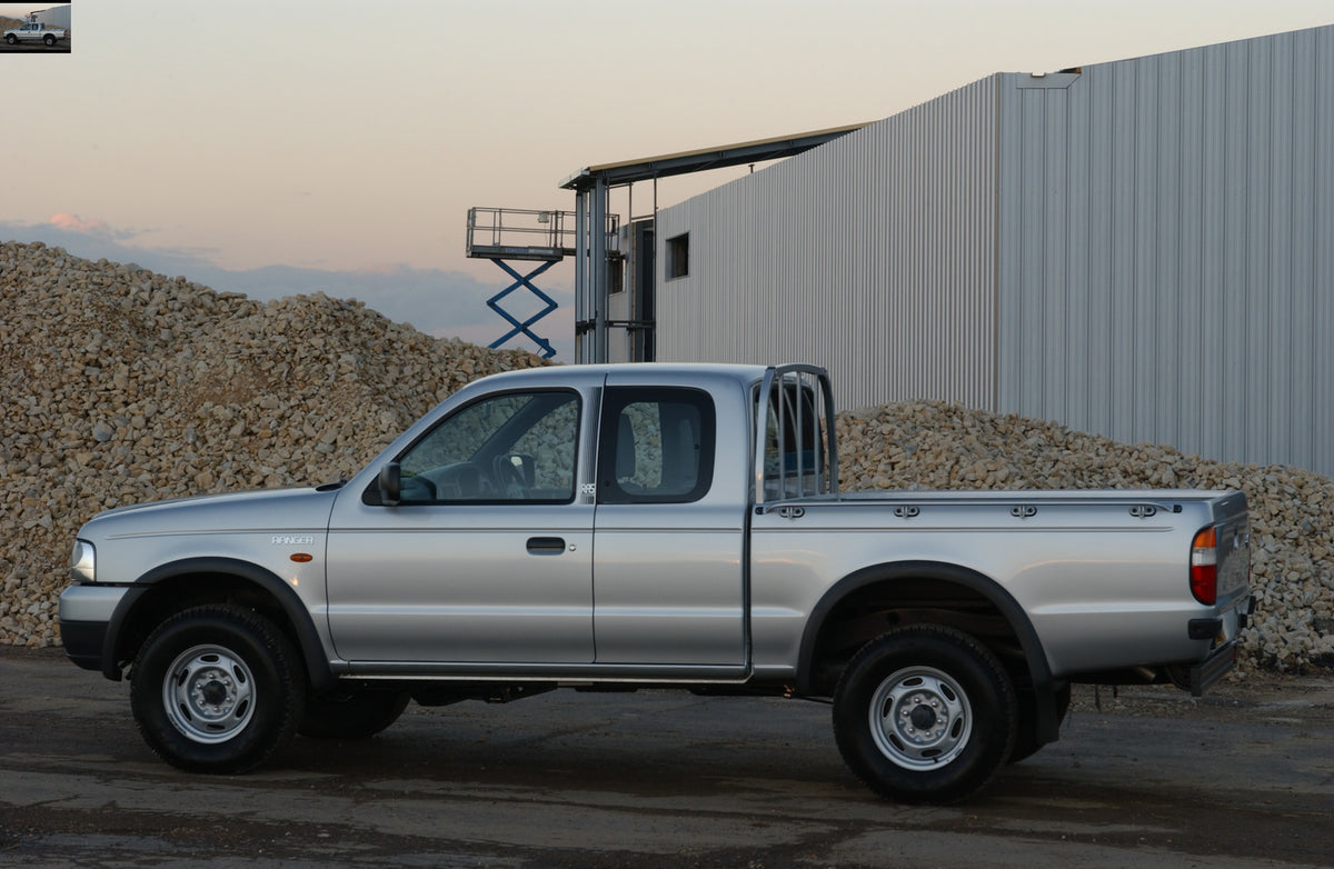 This archival image documents the 2002 Ford Ranger side view in gravel pit and is preserved in the Ford Heritage Vault as part of Ford Motor Company's historic photographic archive. Free for personal, non-commercial use. Ford Heritage Vault refere...