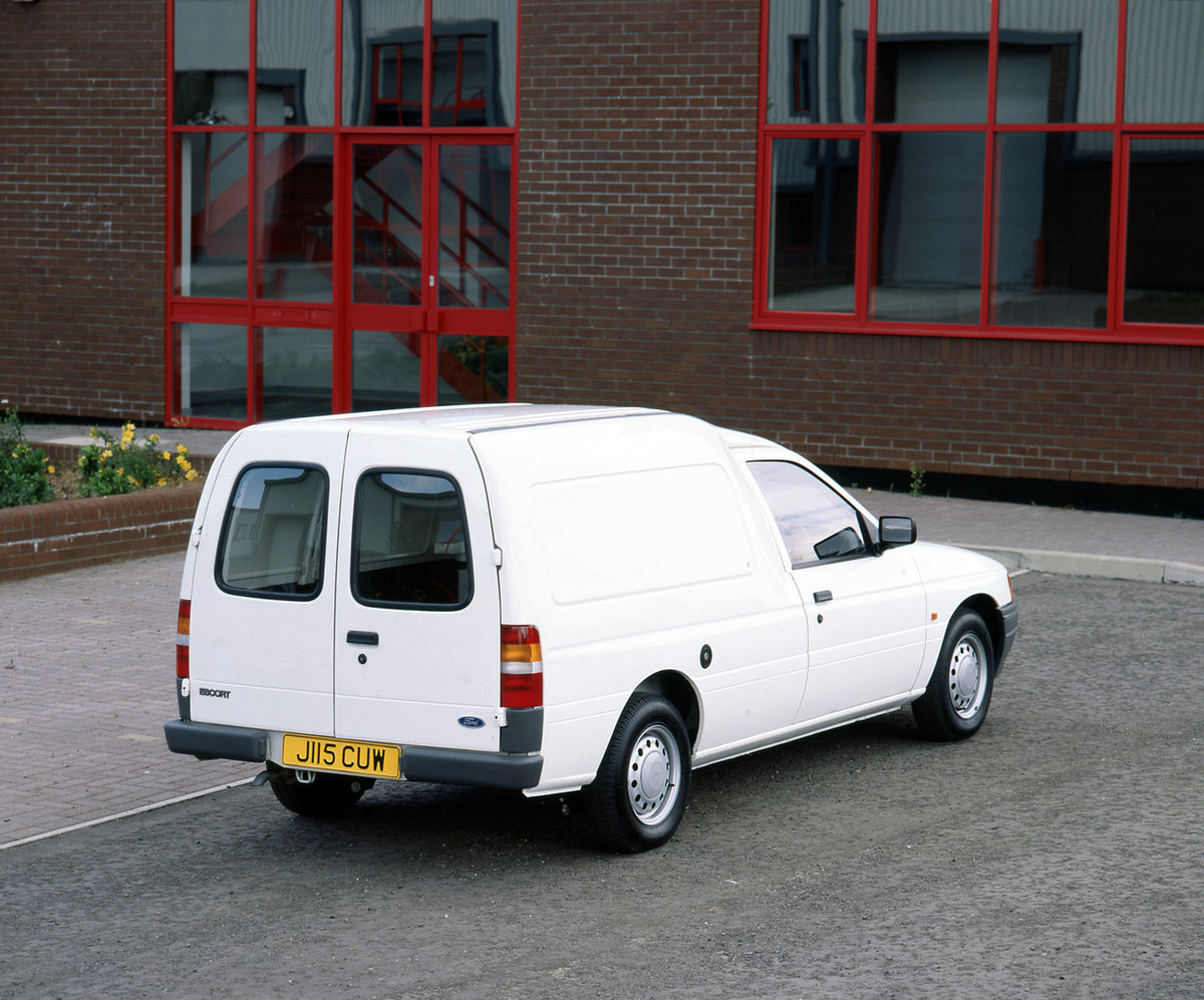 This archival image documents the 1991 Ford Escort Mark IV 6/8 Counterweight Van rear view in front of building and is preserved in the Ford Heritage Vault as part of Ford Motor Company's historic photographic archive. Free for personal, non-comme...