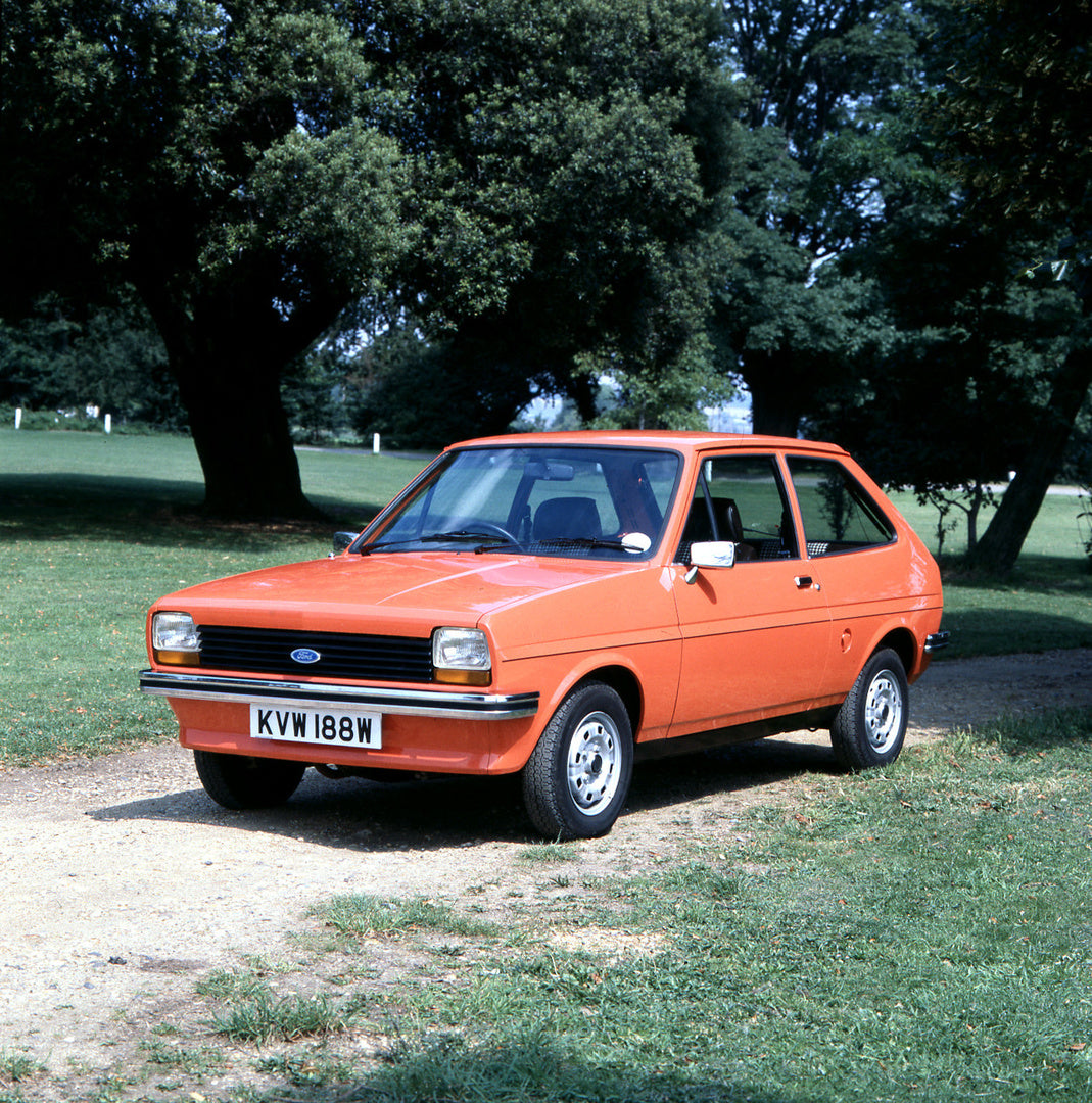 This archival image documents the 1980 Ford Fiesta Mark I L on scenic dirt road with trees and is preserved in the Ford Heritage Vault as part of Ford Motor Company's historic photographic archive. Free for personal, non-commercial use. Ford Herit...