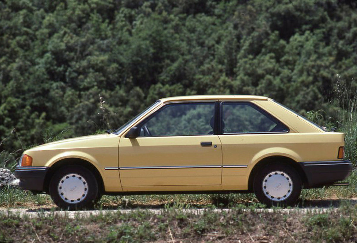 This archival image documents the 1986 Ford Escort Mark IV side view with scenic trees and is preserved in the Ford Heritage Vault as part of Ford Motor Company's historic photographic archive. Free for personal, non-commercial use. Ford Heritage ...