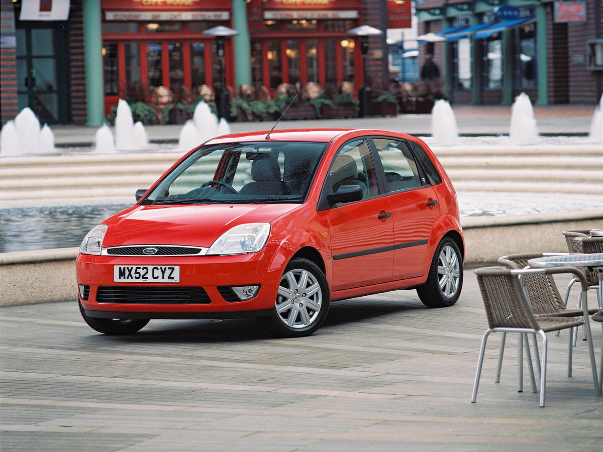 This archival image documents the 2002 Ford Fiesta Mark VI with scenic storefronts and fountain and is preserved in the Ford Heritage Vault as part of Ford Motor Company's historic photographic archive. Free for personal, non-commercial use. Ford ...