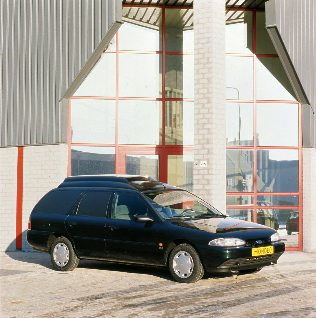 This archival image documents the 1996 Ford Mondeo Mark I LHD van in front of building and is preserved in the Ford Heritage Vault as part of Ford Motor Company's historic photographic archive. Free for personal, non-commercial use. Ford Heritage ...
