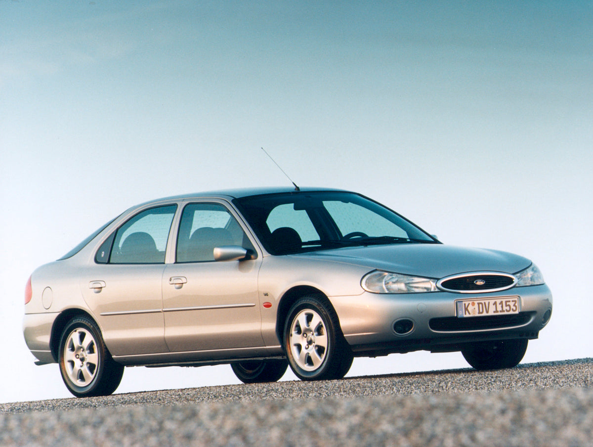 This archival image documents the 1998 Ford Mondeo Mark II Ghia with scenic blue sky and is preserved in the Ford Heritage Vault as part of Ford Motor Company's historic photographic archive. Free for personal, non-commercial use. Ford Heritage Va...