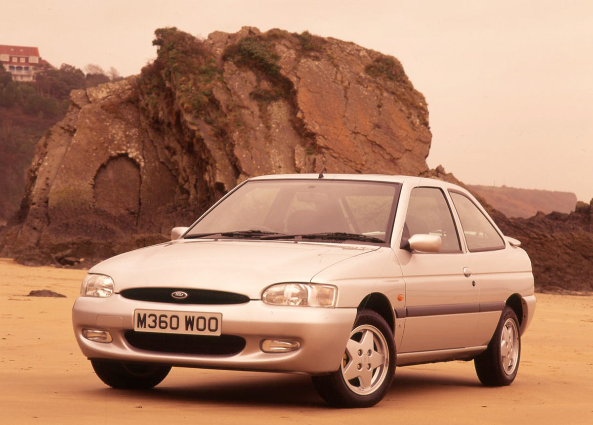 This archival image documents the 1995 Ford Escort Mark VI Si with scenic rock formation and is preserved in the Ford Heritage Vault as part of Ford Motor Company's historic photographic archive. Free for personal, non-commercial use. Ford Heritag...