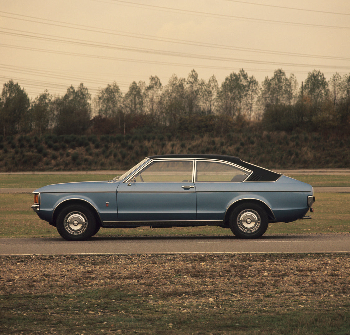 This archival image documents the 1974 Ford Granada Mark I side view on scenic road and is preserved in the Ford Heritage Vault as part of Ford Motor Company's historic photographic archive. Free for personal, non-commercial use. Ford Heritage Vau...