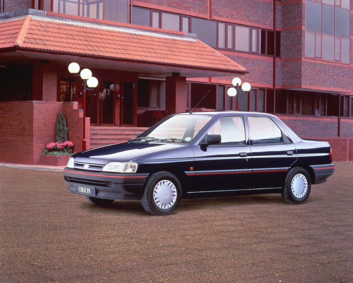 This archival image documents the 1991 Ford Orion MK III LX in front of scenic brick building and is preserved in the Ford Heritage Vault as part of Ford Motor Company's historic photographic archive. Free for personal, non-commercial use. Ford He...