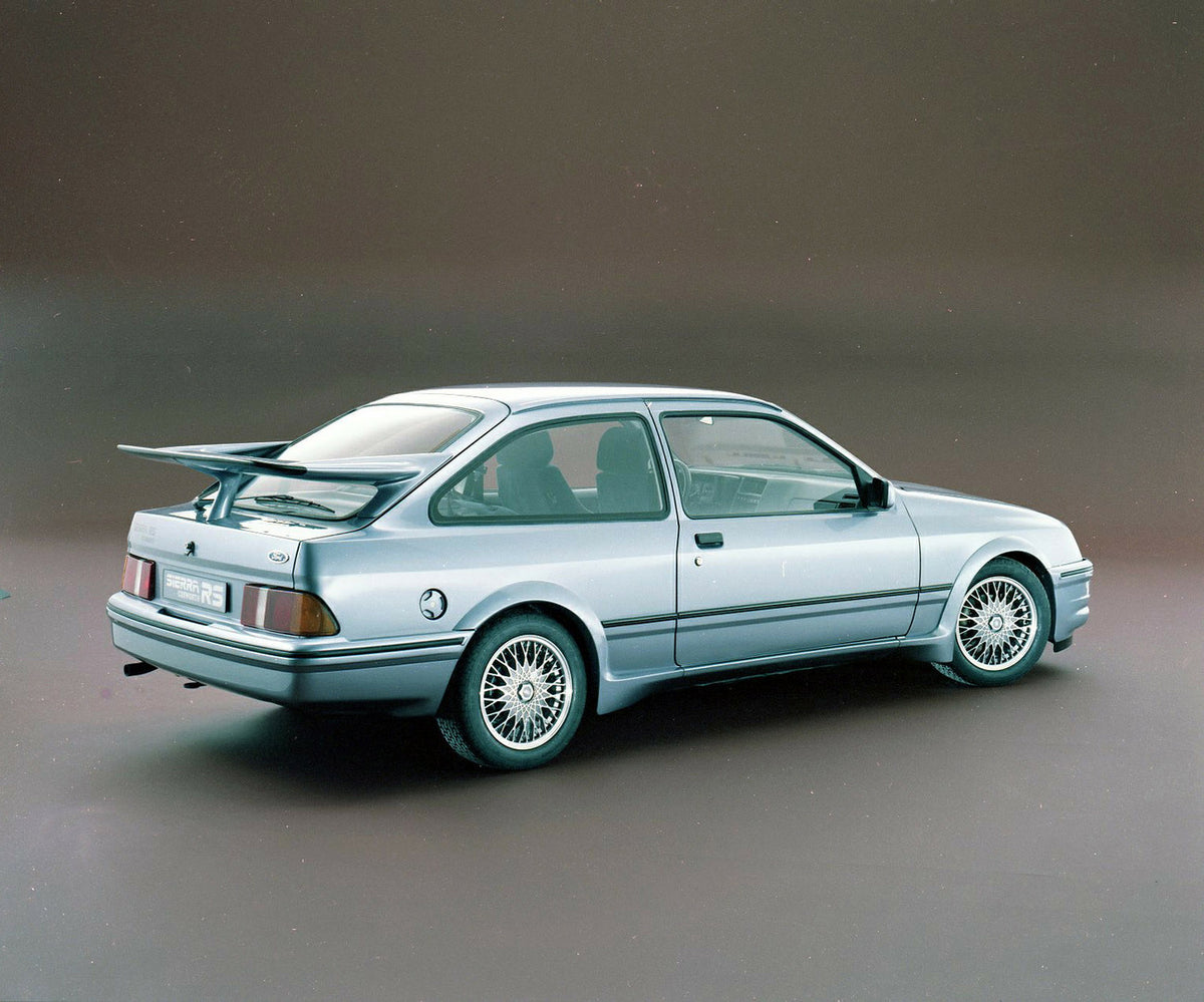 This archival image documents the 1985 Ford Sierra RS Cosworth rear view in studio and is preserved in the Ford Heritage Vault as part of Ford Motor Company's historic photographic archive. Free for personal, non-commercial use. Ford Heritage Vaul...