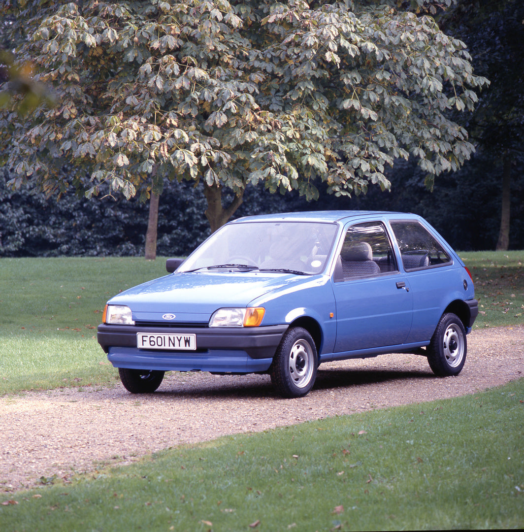 This archival image documents the 1988 Ford Fiesta Mark III on scenic road with trees and is preserved in the Ford Heritage Vault as part of Ford Motor Company's historic photographic archive. Free for personal, non-commercial use. Ford Heritage V...
