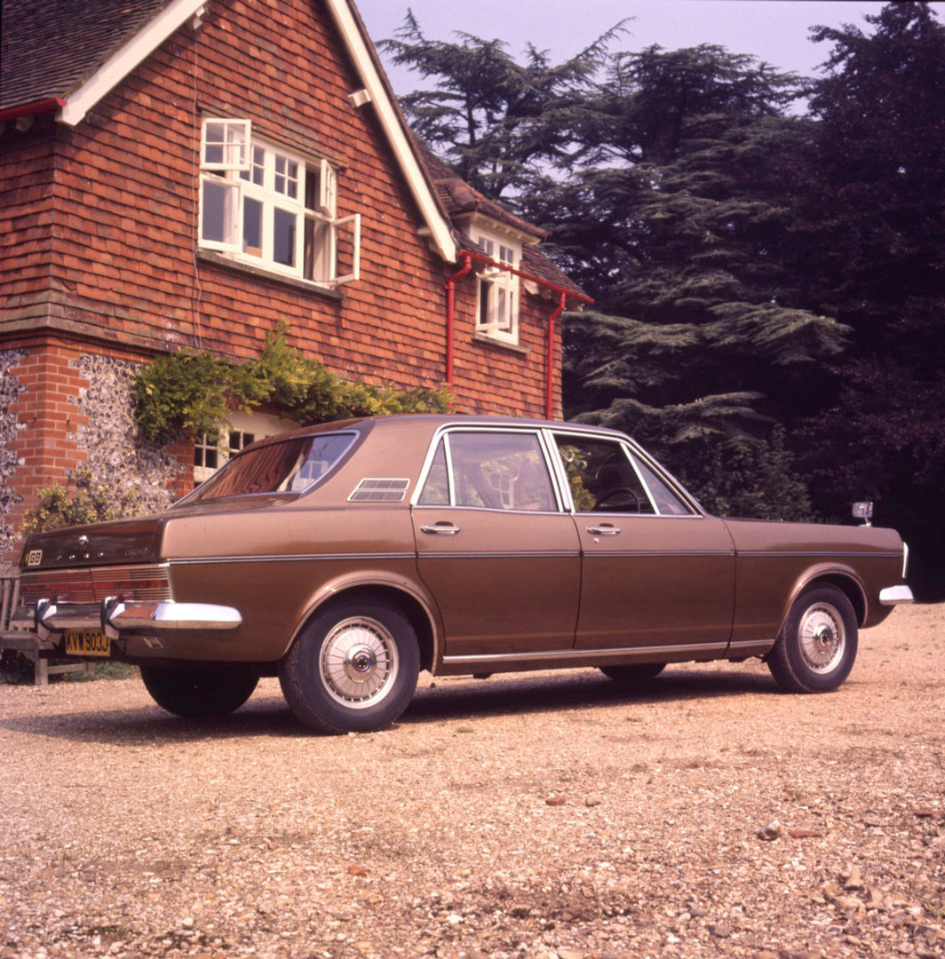 This archival image documents the 1971 Ford Zodiac Mark VI Executive rear view with scenic house and trees and is preserved in the Ford Heritage Vault as part of Ford Motor Company's historic photographic archive. Free for personal, non-commercial...