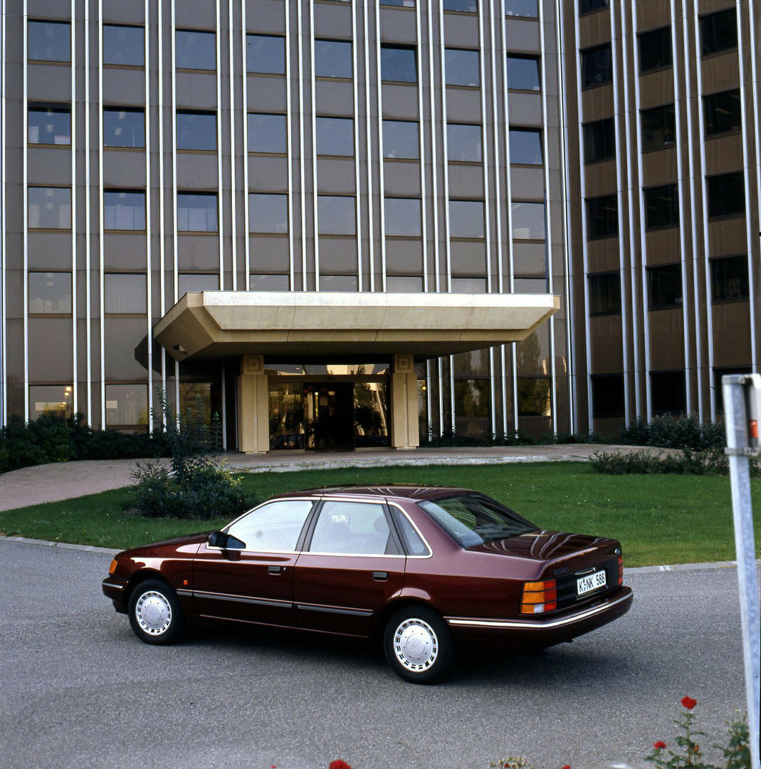 This archival image documents the 1989 Ford Scorpio Mark I rear view in front of building and is preserved in the Ford Heritage Vault as part of Ford Motor Company's historic photographic archive. Free for personal, non-commercial use. Ford Herita...