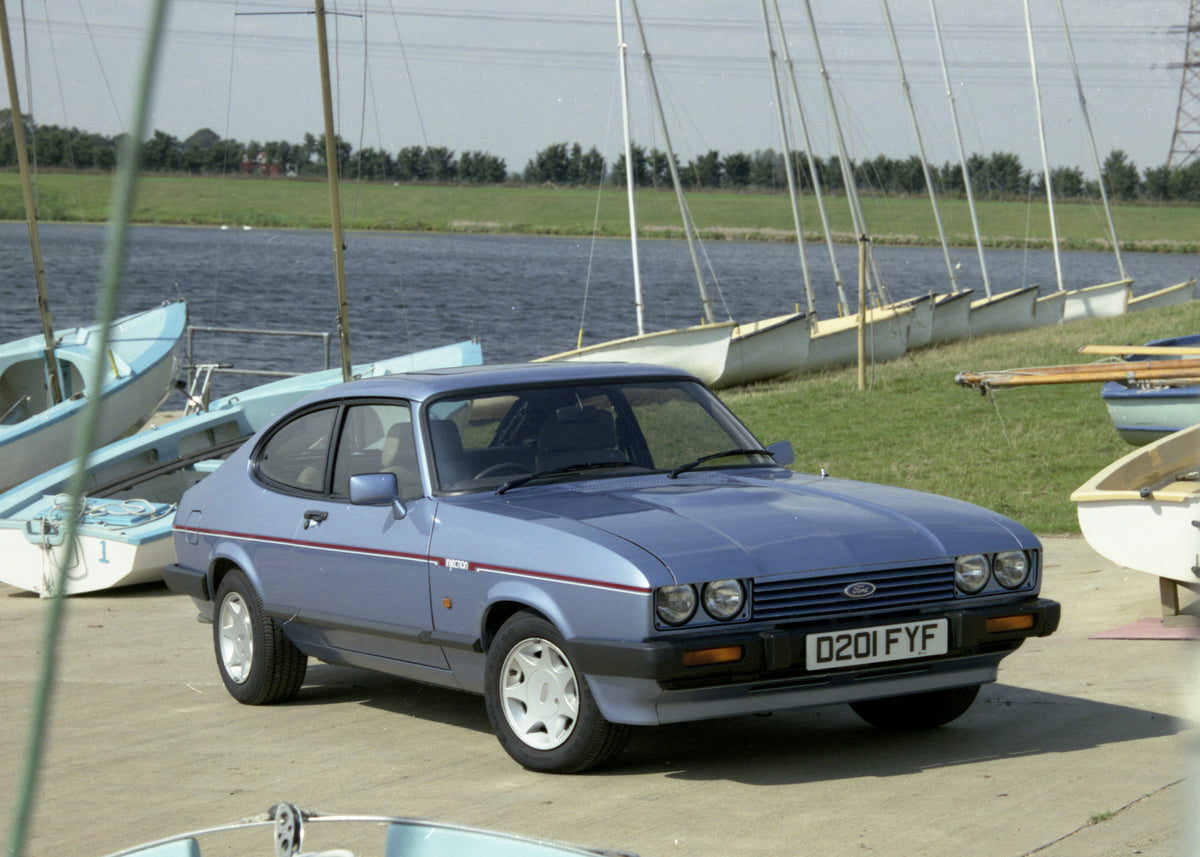 This archival image documents the 1986 Ford Capri Mark III with scenic sail boats 1986-746 57 and is preserved in the Ford Heritage Vault as part of Ford Motor Company's historic photographic archive. Free for personal, non-commercial use. Ford He...