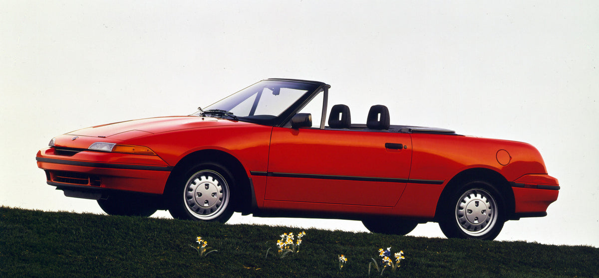 This archival image documents the 1991 Mercury Capri convertible side view CN59019-1 and is preserved in the Ford Heritage Vault as part of Ford Motor Company's historic photographic archive. Free for personal, non-commercial use. Ford Heritage Va...