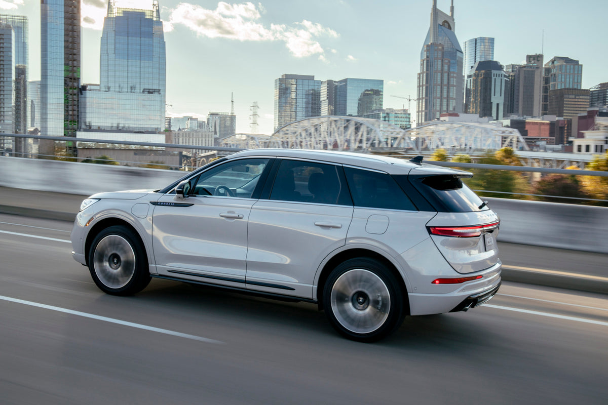 This archival image documents the 2021 Lincoln Corsair Grand Touring action shot on city road and is preserved in the Ford Heritage Vault as part of Ford Motor Company's historic photographic archive. Free for personal, non-commercial use. Ford He...