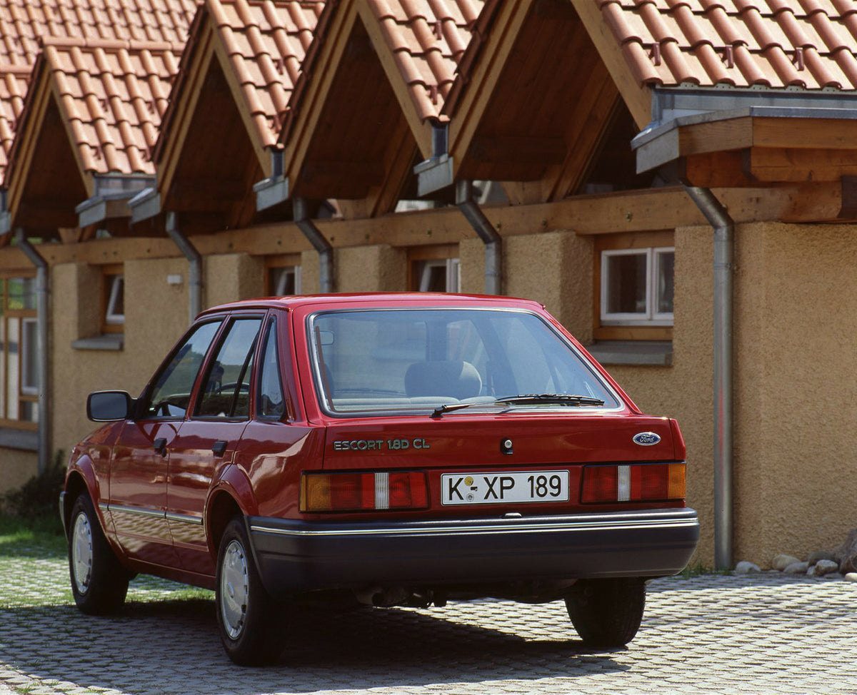 This archival image documents the 1989 Heritage Archive - 1988 Ford Escort Mark IV 1.8D CL rear view in front of scenic building and is preserved in the Ford Heritage Vault as part of Ford Motor Company's historic photographic archive. Free for pe...