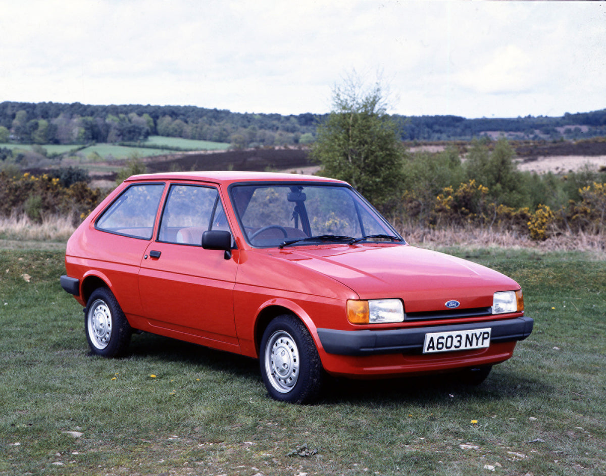 This archival image documents the 1983 Ford Fiesta Mark II in scenic field with trees and is preserved in the Ford Heritage Vault as part of Ford Motor Company's historic photographic archive. Free for personal, non-commercial use. Ford Heritage V...