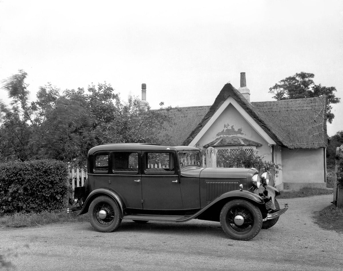 This archival image documents the 1932 Ford Model B side view in front of scenic house 9 E 14 and is preserved in the Ford Heritage Vault as part of Ford Motor Company's historic photographic archive. Free for personal, non-commercial use. Ford He...