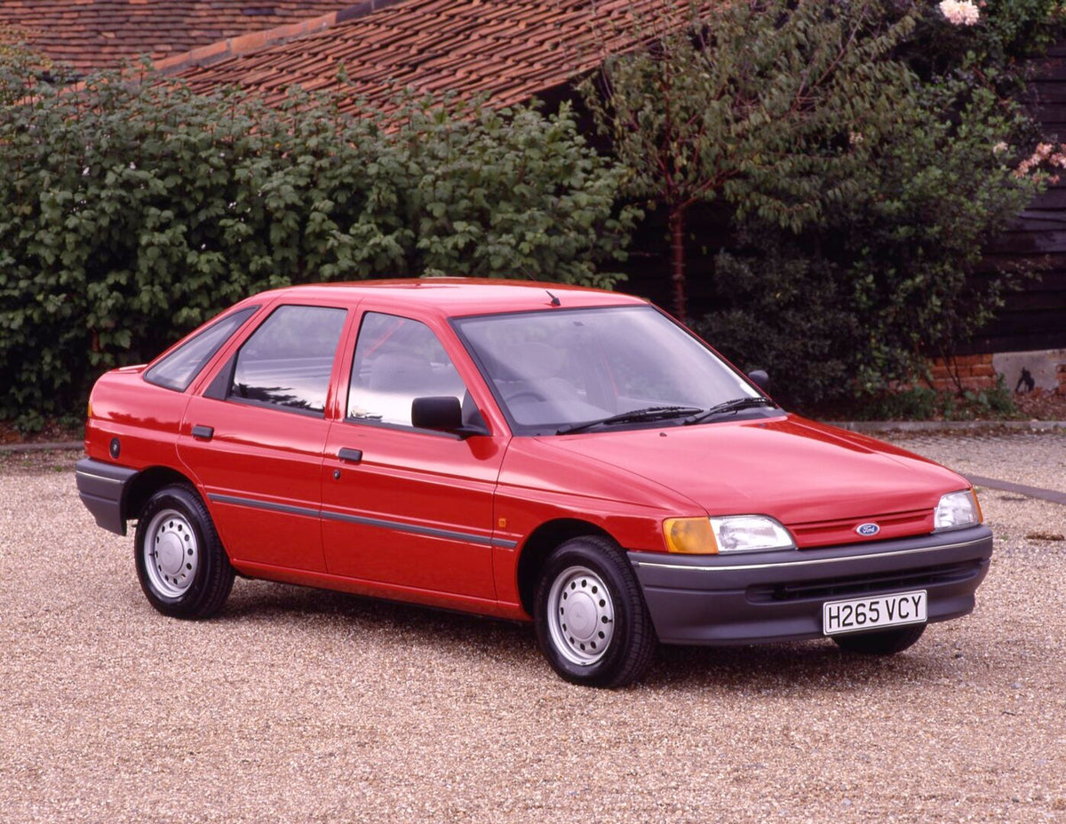 This archival image documents the 1990 Ford Escort Mark V Popular closeup on scenic gravel road and is preserved in the Ford Heritage Vault as part of Ford Motor Company's historic photographic archive. Free for personal, non-commercial use. Ford ...