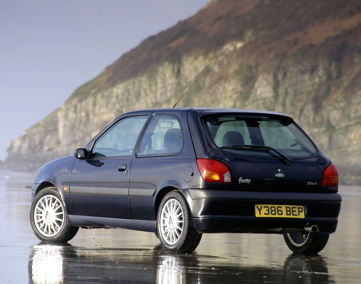 This archival image documents the 2001 Ford Fiesta Mark V Zetec-S rear view on scenic beach and is preserved in the Ford Heritage Vault as part of Ford Motor Company's historic photographic archive. Free for personal, non-commercial use. Ford Heri...