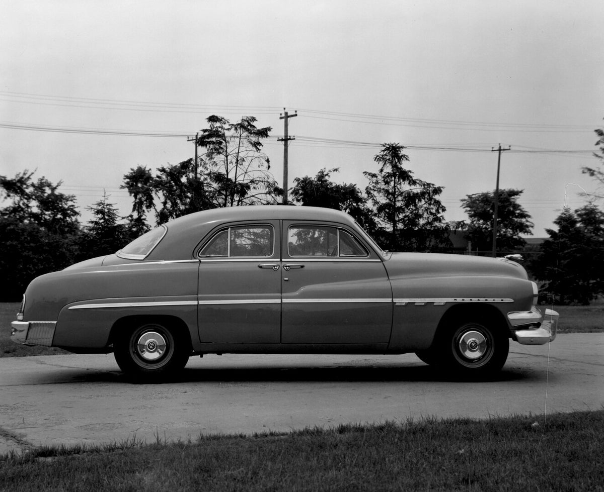 This archival image documents the 1951 Monarch Sedan side view on scenic road with trees AR-2007-5 and is preserved in the Ford Heritage Vault as part of Ford Motor Company's historic photographic archive. Free for personal, non-commercial use. Fo...