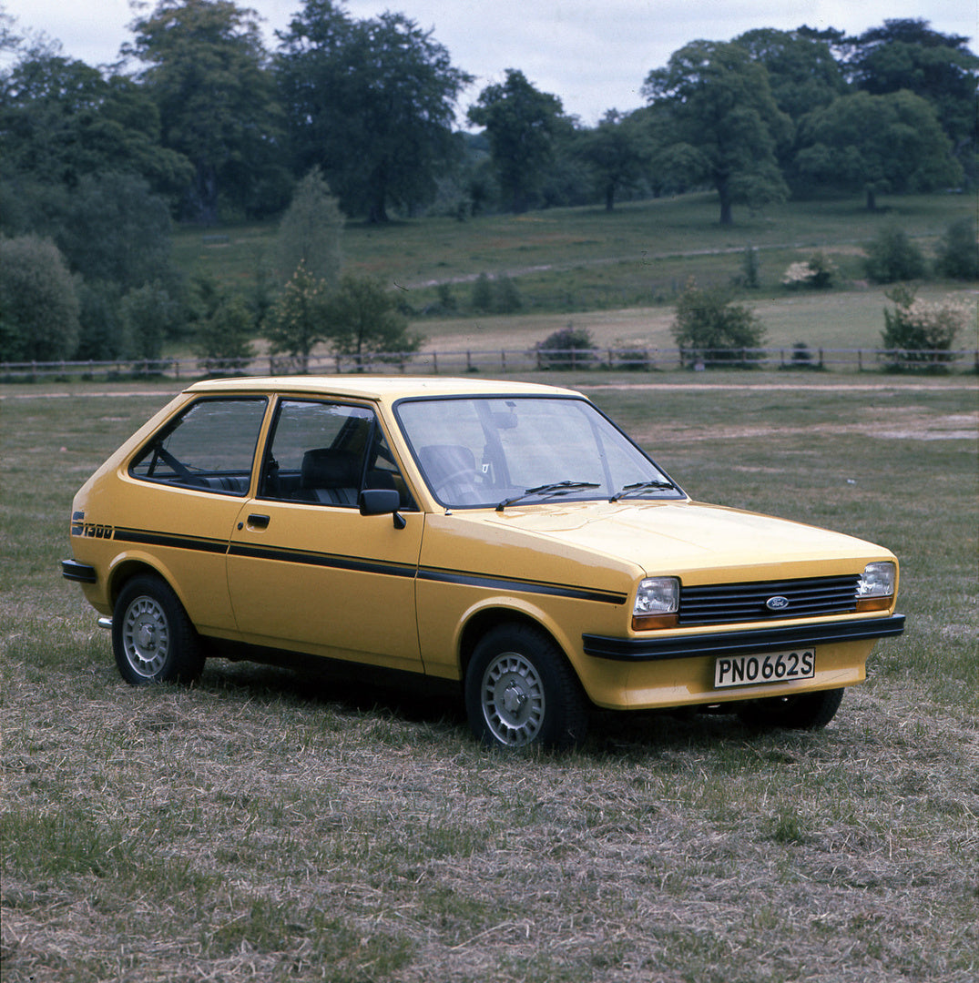 This archival image documents the 1977 Ford Fiesta Mark I 1300 Sport in scenic field and is preserved in the Ford Heritage Vault as part of Ford Motor Company's historic photographic archive. Free for personal, non-commercial use. Ford Heritage Va...