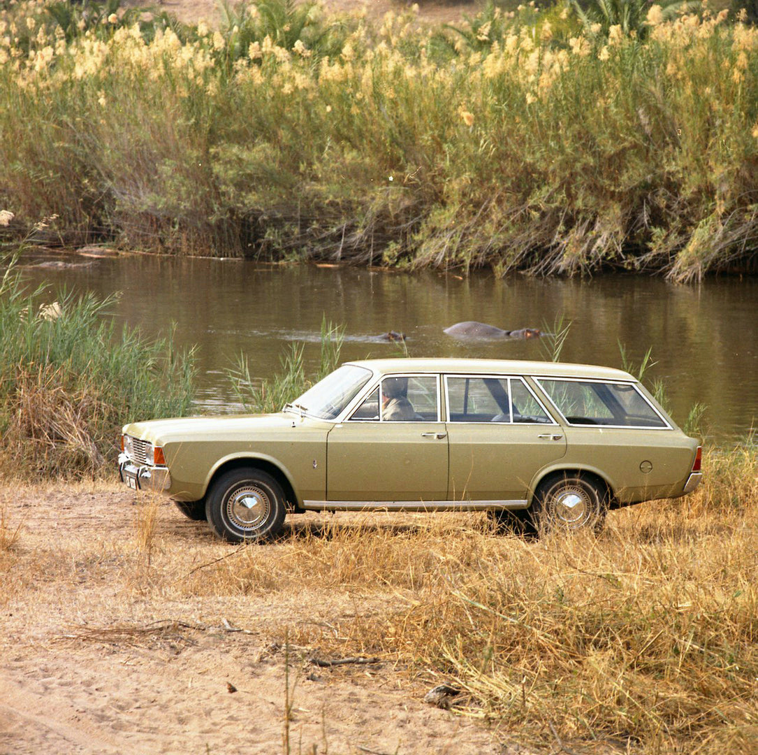 This archival image documents the 1971 Ford Taunus 20M Estate side view with river and hippos and is preserved in the Ford Heritage Vault as part of Ford Motor Company's historic photographic archive. Free for personal, non-commercial use. Ford He...