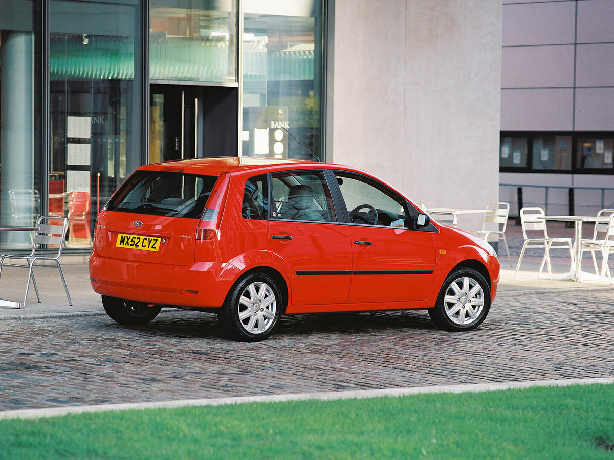 This archival image documents the 2002 Ford Fiesta Mark VI rear view in front of building and is preserved in the Ford Heritage Vault as part of Ford Motor Company's historic photographic archive. Free for personal, non-commercial use. Ford Herita...