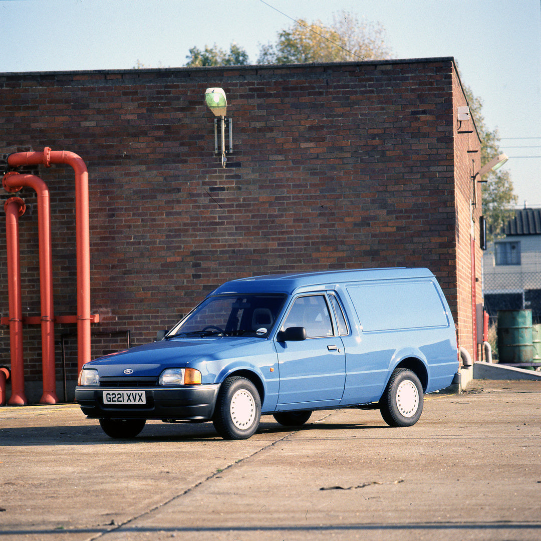 This archival image documents the 1989 Ford Escort Mark IV 6/8 Counterweight 55 Van in front of building and is preserved in the Ford Heritage Vault as part of Ford Motor Company's historic photographic archive. Free for personal, non-commercial u...